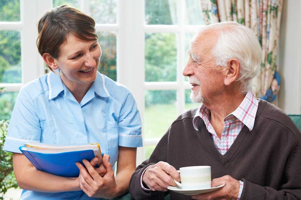 Older adults sitting at a table enjoying a balanced meal together in a bright dining room.
